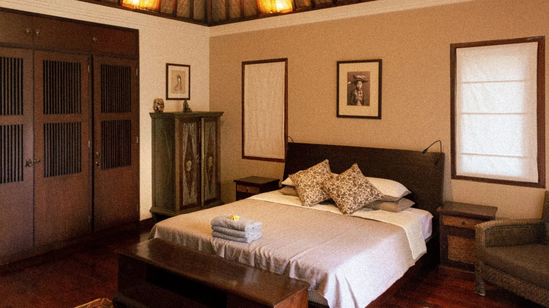 A Balinese-style bedroom with carved wooden details